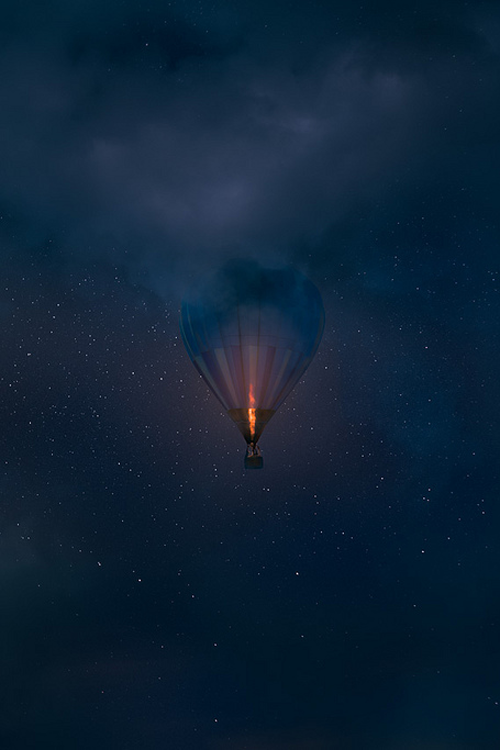 Glowing Hot Air Balloon Aerial Night Sky