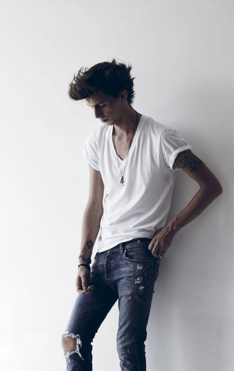 Tattooed Man Portrait Dimly Lit Room