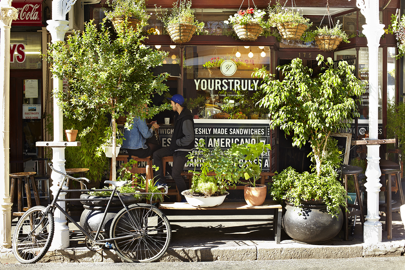 Lush Greenery Adorned Cafe City Street