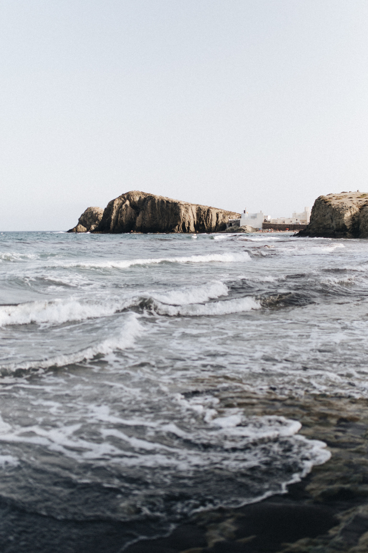 Coastal Rocks And Buildings Landscape Photography