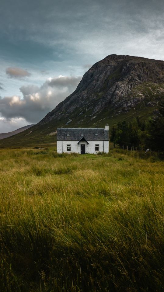 Stone Cottage In Scottish Highlands Landscape