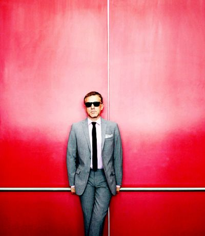 Businessman Portrait Against Red Background