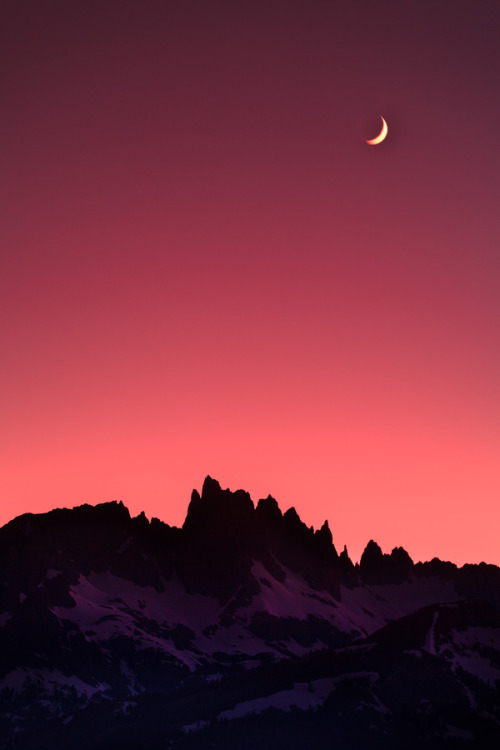 Crescent Moon Over Mountain Peaks Landscape