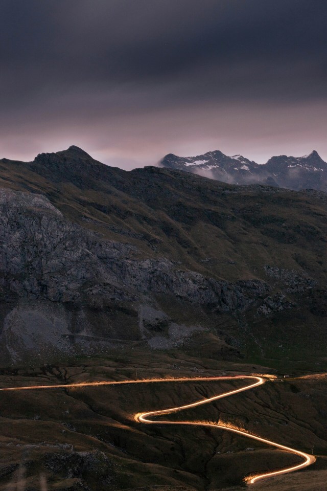 Winding Mountain Road Snowy Peaks Landscape