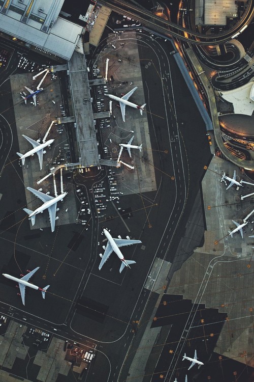 Aerial View Of Bustling Airport Tarmac