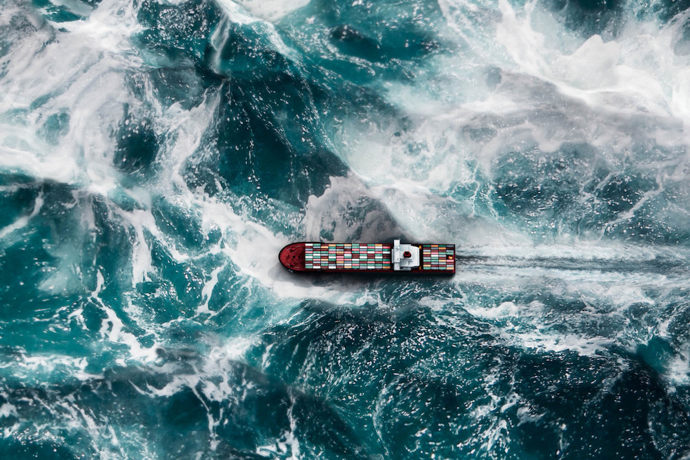 Cargo Ship In Stormy Ocean Aerial Landscape