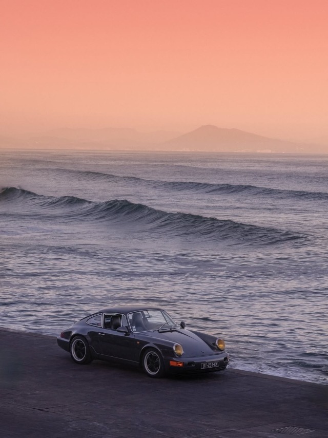 Black Sports Car Ocean Waves Sunset