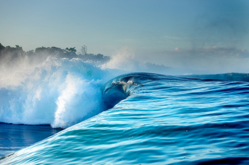 Dramatic Ocean Wave Surfing Aerial Photography