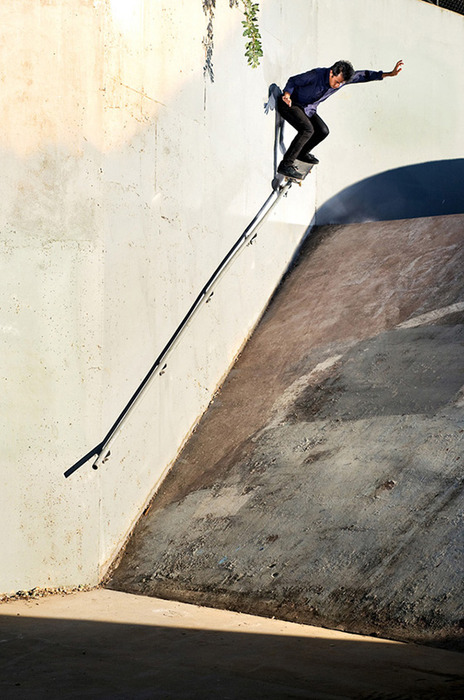 Skateboarder Navigates Urban Quarterpipe