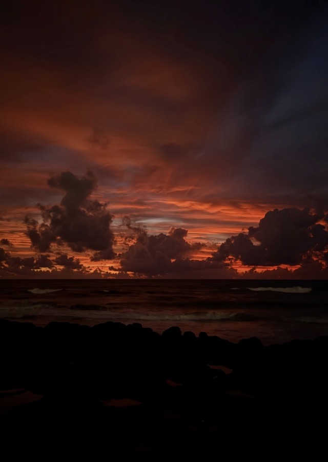 Dark Clouds Vibrant Orange Sunset Ocean Coastline