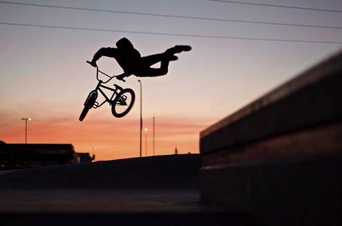 Bmx Rider Performs Sunset Stunt