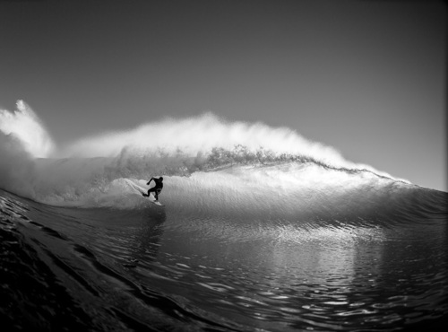 Surfer Riding Massive Ocean Wave Aerial