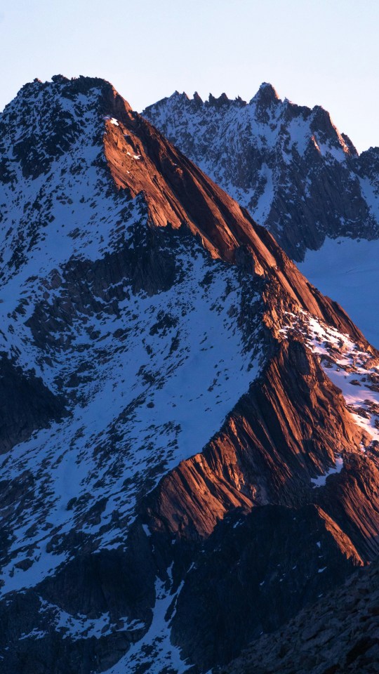 Snow Capped Mountain Peaks Sunlit Ridge