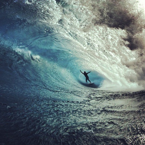 Surfer Riding Massive Wave Ocean Landscape