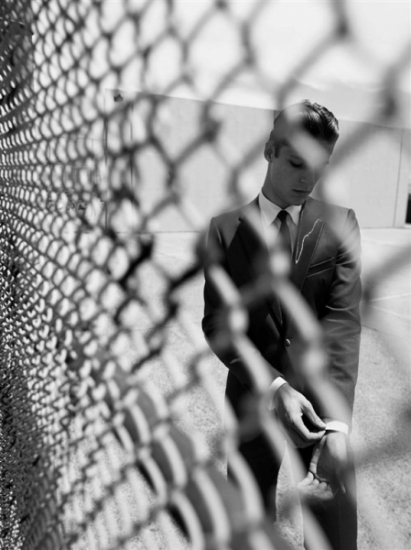 Businessman Portrait Behind Wired Fencing