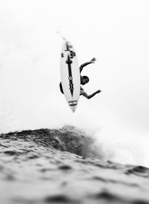 Aerial Surfer Over Crashing Ocean Waves