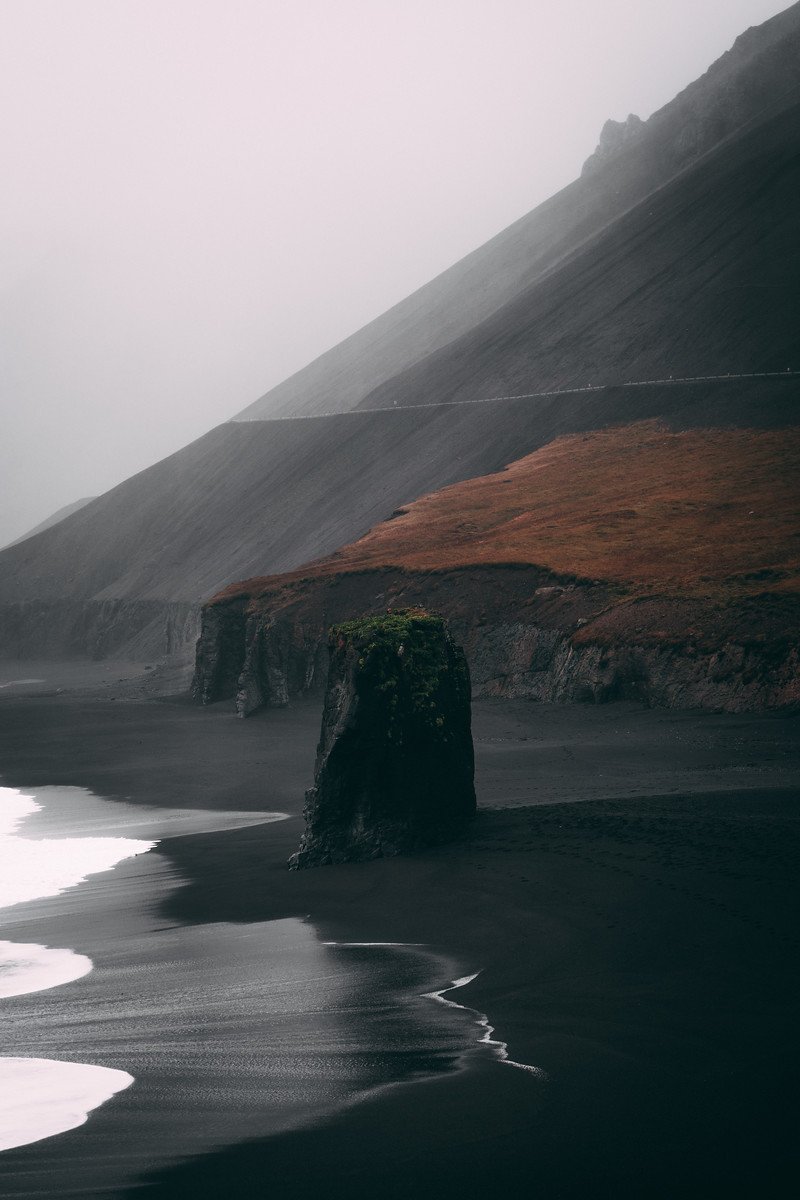 Black Sand Beach Rock Formation Coastal Mountains Fog