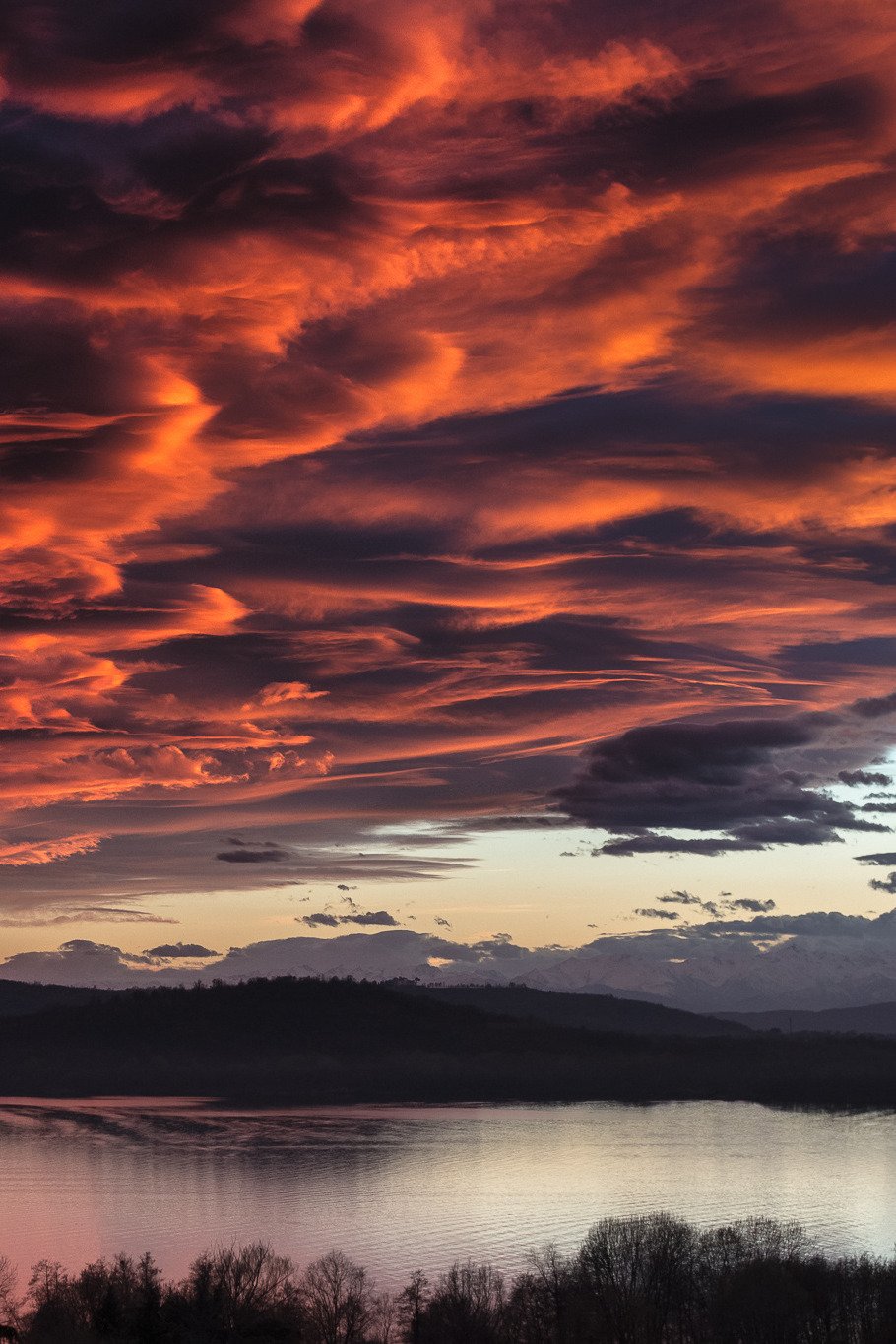 Orange Red Sunset Clouds Over Lake Water Silhouette Hills
