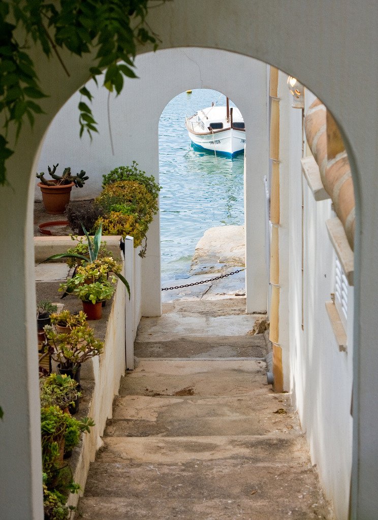 White Arched Doorway Stone Steps Mediterranean Coastal Village Boat