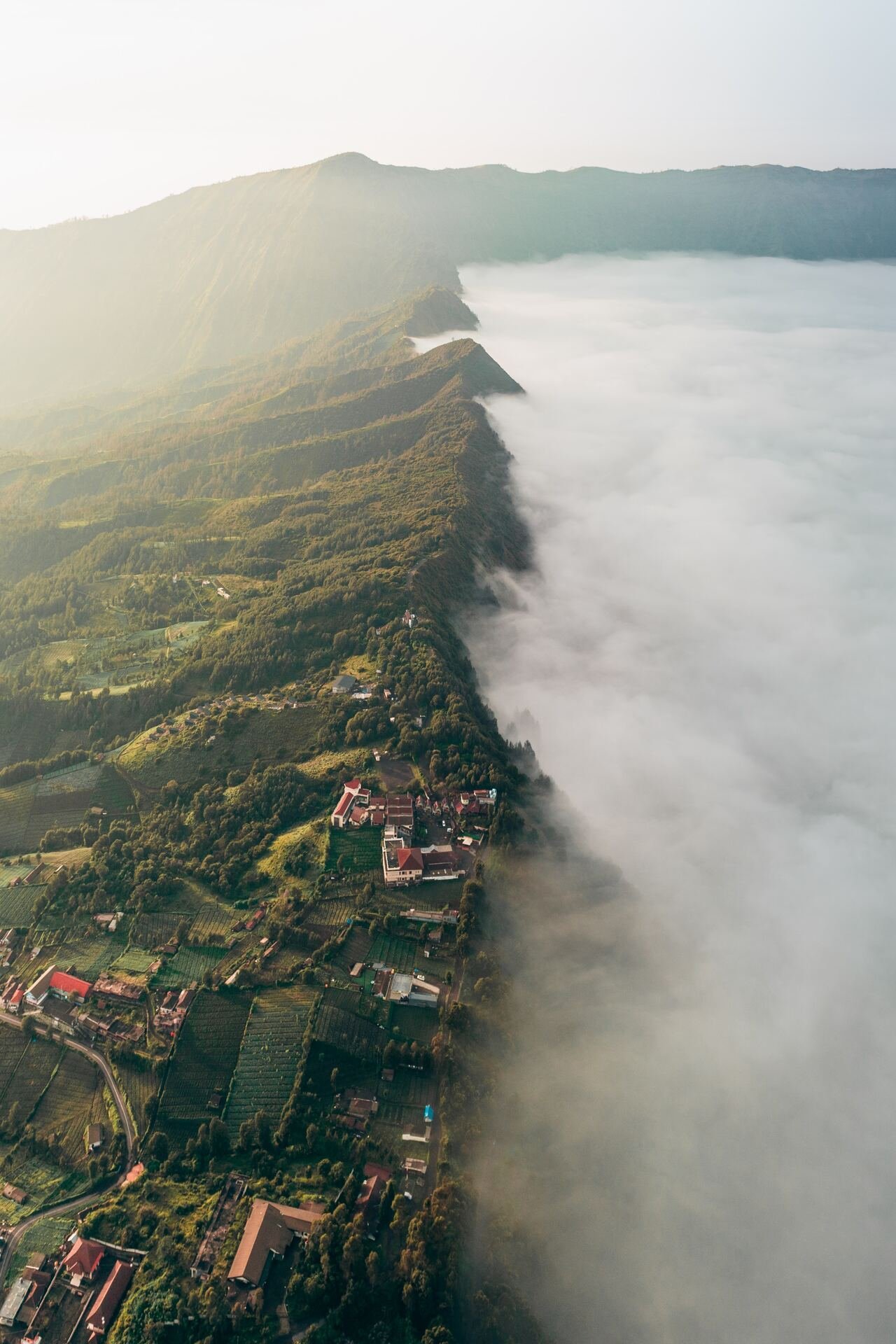 Mountain Ridge Village Low Clouds Aerial View Green Slopes