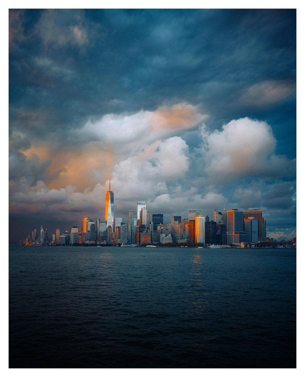 Manhattan Skyline One World Trade Center Storm Clouds Sunset