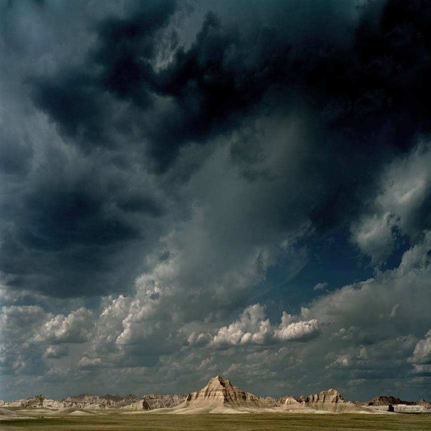 Dark Storm Clouds Over Desert Badlands Rock Formations