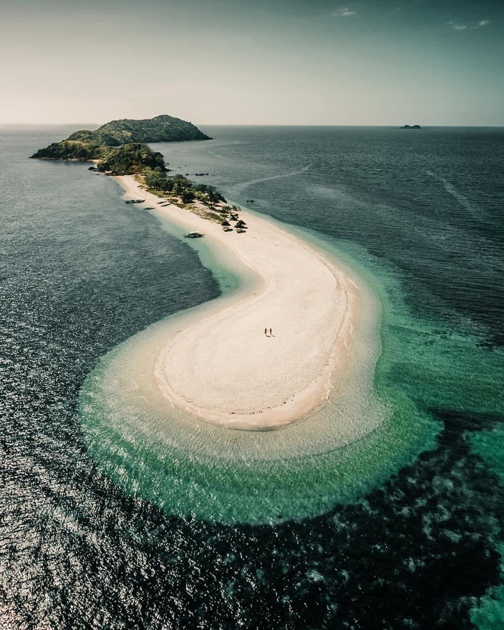 Curved White Sand Beach Connecting Green Island Turquoise Waters Aerial View