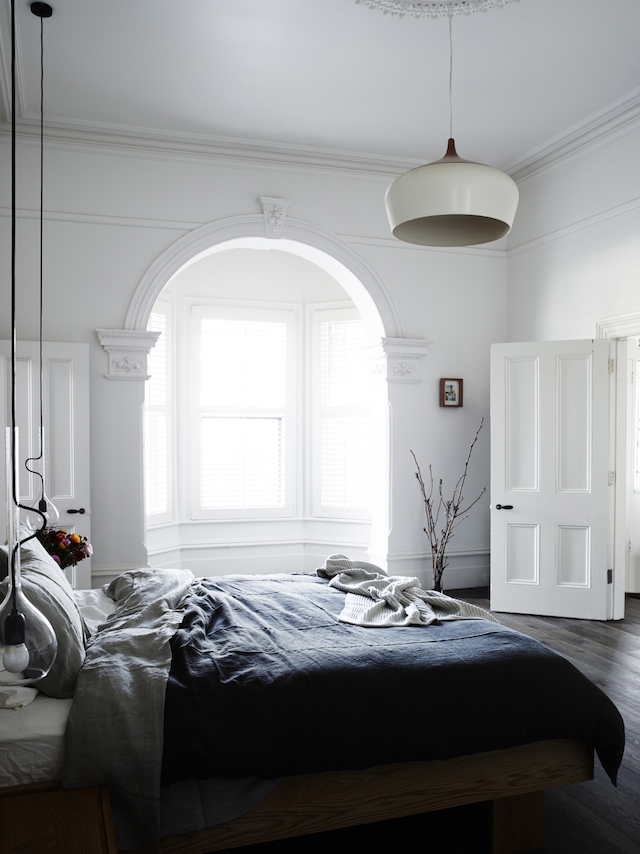 Cozy Bedroom With Arched Windows Interior